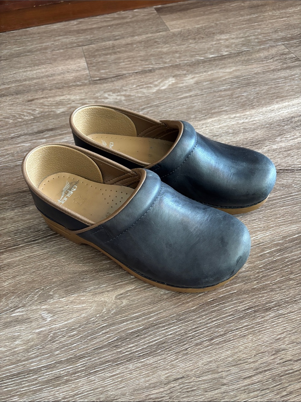 Dansko Black Leather Slip-On Women's Clogs